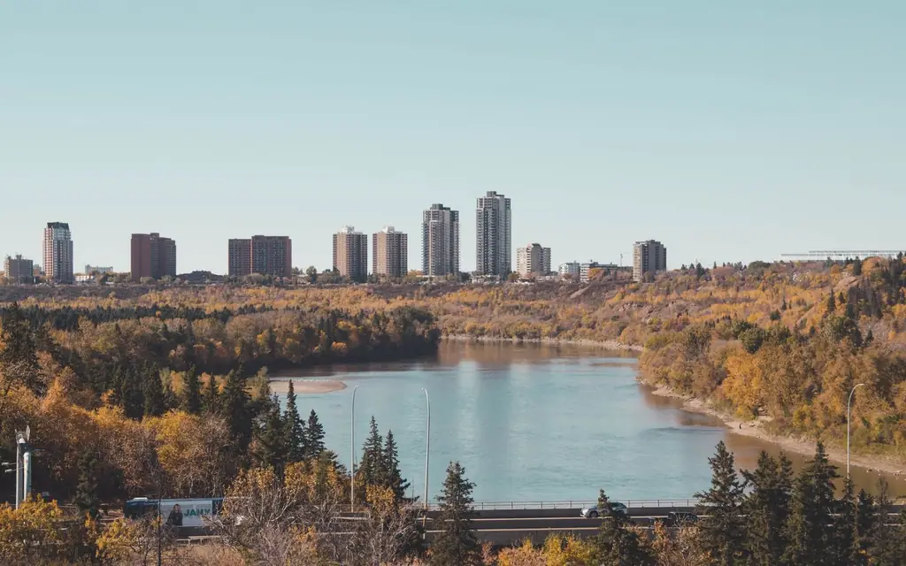 Breathtaking cityscape with a river and fall foliage, perfect autumn travel destination